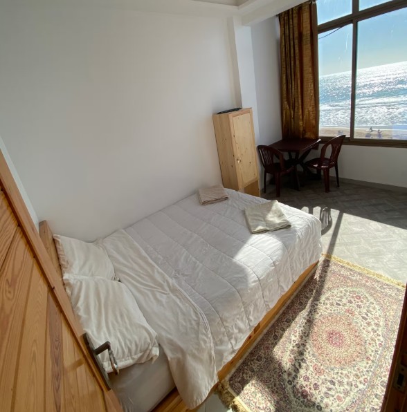 Bright bedroom with an ocean view