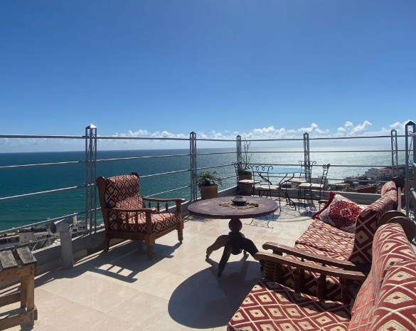 Rooftop seating overlooking the Atlantic in Taghazout