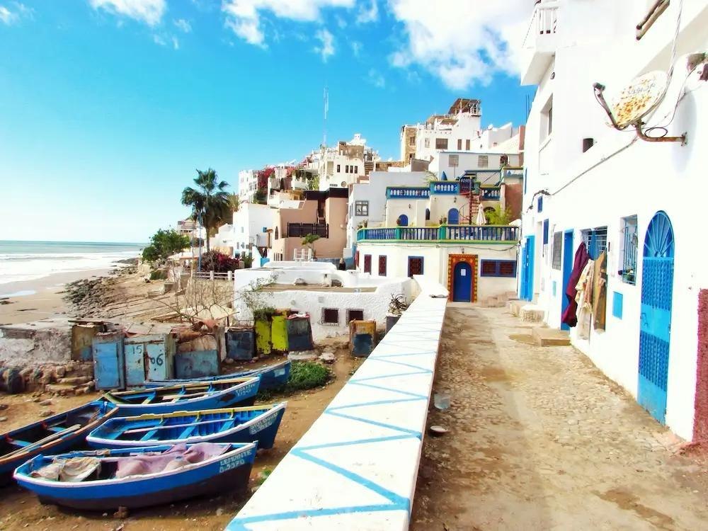 Colourful houses and fishing boats on the Taghazout waterfront